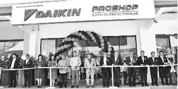  ??  ?? From left, Yap, Lo, Chia, Tan, Yeh, Chu, Sim, Fang, Ooi, Song, Chai, Lai and Choy cut the ribbon to mark the opening of the Daikin Proshop.