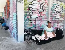  ?? CARLINE JEAN/SOUTH FLORIDA SUN SENTINEL ?? Tiffany Minnield makes her home on the streets of Fort Lauderdale. During the pandemic, Fort Lauderdale started a hotel voucher program to help find hotel rooms for the homeless.