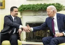  ?? ALEX BRANDON / ASSOCIATED PRESS ?? President Joe Biden and Iraq’s Prime Minister Shia al-sudani shake hands during a meeting in the Oval Office of the White House, Monday, in Washington.