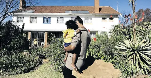  ??  ?? A victim of gender violence with her child at Frida Hartley shelter in Yeoville, Johannesbu­rg. There has been a national outcry over the spate of violence against women.