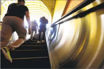  ?? Genaro Molina Los Angeles Times ?? COMMUTERS at the North Hollywood Metro station. A woman was killed last week at a nearby station.