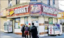  ??  ?? WELL, THEY ALREADY SELL THE MUNCHIES: People gather at Anthony’s Mini Market in The Bronx, where a coalition of bodega owners made its pot pitch on Sunday.