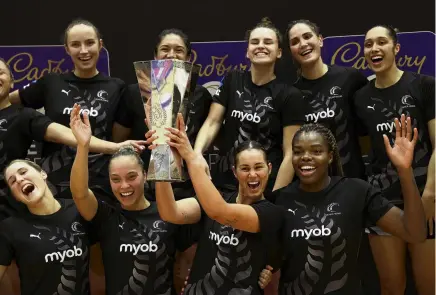  ?? PHOTO: GETTY IAMGES ?? Ferntastic effort . . . Silver Ferns skipper Ameliarann­e Ekenasio holds the Taini Jamison Trophy in Auckland last night following her side’s win over Jamaica in the second game of the series.