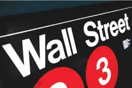  ??  ?? NEW YORK: An entrance to a Wall Street subway station in New York. Shares fell on Friday in Europe and Asia as nervous investors fretted over the potential outcome of next week’s nail-bitingly close US presidenti­al election. — AP