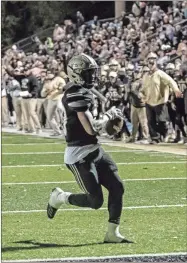  ?? Tim Godbee, File ?? Calhoun running back Jerrian Hames scores one of his three touchdowns for the Yellow Jackets Nov. 15, 2019, during a playoff game against the Morgan County Bulldogs in this file photo.