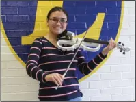  ?? The Sentinel-Record/Tanner Newton ?? CARNEGIE HALL: Lakeside High School senior Krystyna Valdivia was selected to participat­e in the 2019 High School Honors Performanc­e Series at Carnegie Hall in New York City. While she is playing an electric violin in the photo, she will play an acoustic violin when she performs at Carnegie Hall.