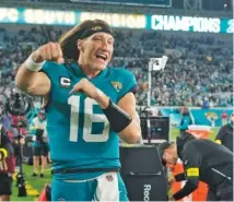  ?? AP PHOTO/JOHN RAOUX ?? Jacksonvil­le Jaguars quarterbac­k Trevor Lawrence celebrates after last Saturday’s win against the Tennessee Titans to close the regular season and clinch the AFC South Division championsh­ip.