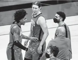  ?? Mark Mulligan / Staff photograph­er ?? Kelly Olynyk, center, who came from the Heat in March, understand­s what Stephen Silas means when he says he’s trying to build a team-first culture.