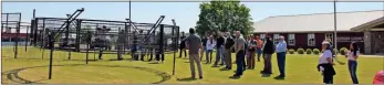  ?? Blake Silvers ?? A couple of dozen participan­ts at the Gordon County Agricultur­al Service Center watch a trap demonstrat­ion.