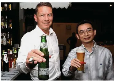  ??  ?? Cheers: Lehmann (left) and chief financial officer Lim Chee Keat in good spirits after announcing the company’s financial results. Lehmann says the firm will continue to focus its resources on great innovation­s.