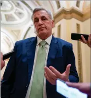  ?? AP PHOTO BY J. SCOTT APPLEWHITE ?? House Minority Leader Kevin Mccarthy, R-calif., talks to reporters at the Capitol in Washington, April 6, 2022. Mccarthy is downplayin­g secretly recorded remarks he made about Donald Trump shortly after last year’s attack on the Capitol. He also says he never told the then-president that he should resign — something that has not been reported.