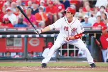  ?? AP PHOTO/AL BEHRMAN ?? Saturday’s Chattanoog­a Lookouts game includes a bobblehead giveaway of the Cincinnati Reds’ Joey Votto.