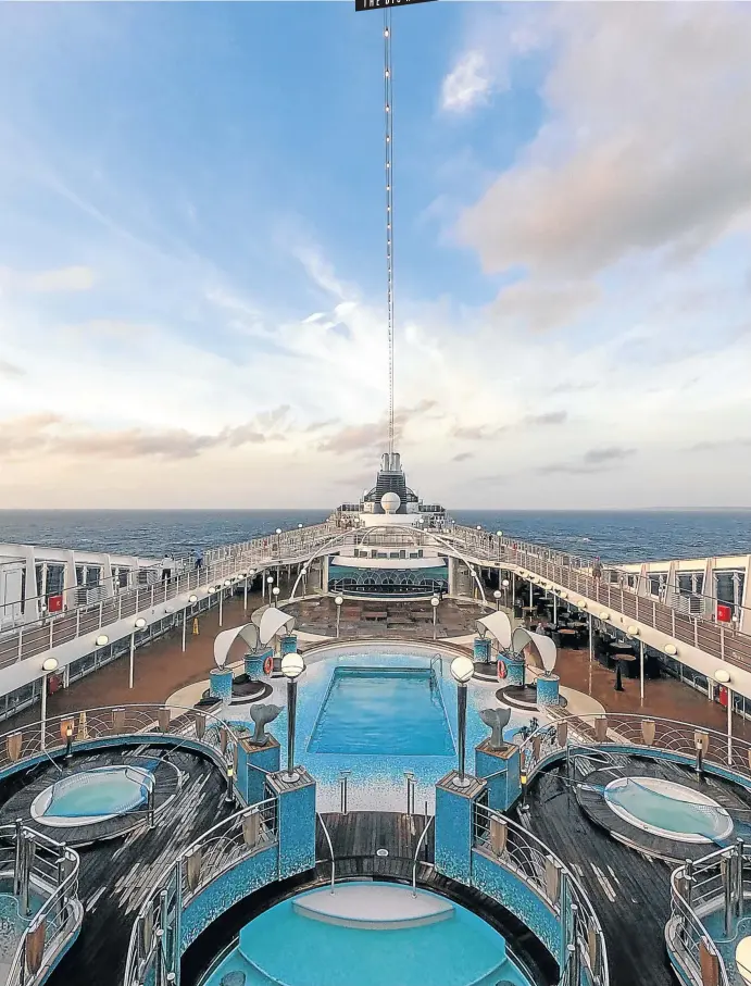  ?? Picture: Mike Eloff ?? CENTRAL SPLASH A view of the pool deck on board the MSC Musica.