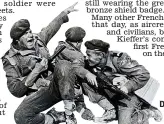  ??  ?? Bravery: A scene from The Longest Day showing Kieffer
leading his troops