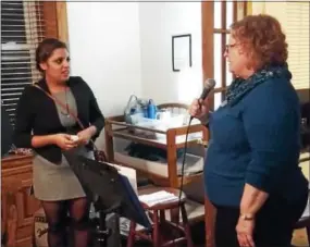  ?? FRAN MAYE — DIGITAL FIRST MEDIA ?? Susan Minarchi, right, executive director of Family Promise of Southern Chester County, introduces a mother of two who recently went through the program.