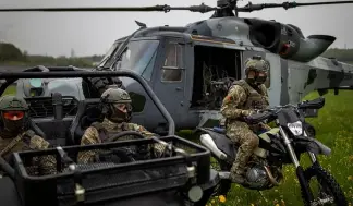  ?? ?? Soldiers from the Lithuania's Army take part in a NATO military exercise in Lithuania on May 12, 2022.
