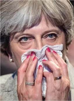  ??  ?? Under the weather: Theresa May at conference yesterday
