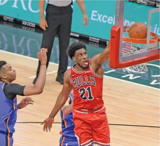  ?? MARK BLACK/AP ?? Bulls forward Thaddeus Young, who had 17 points, dunks against Thunder center Moses Brown in the second quarter Tuesday night.