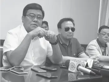 ??  ?? Cebu City Vice Mayor Edgardo Labella, together with Councilor Raymond Alvin Garcia and City Council Secretary Vincent Alix, clarifies that the session was already adjourned when the members of the opposition left the session hall Wednesday night.
