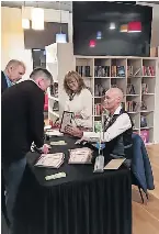  ?? ?? Novella Patrick signing books