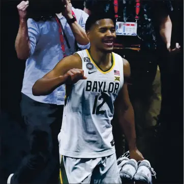 ?? DARRON CUMMINGS — THE ASSOCIATED PRESS ?? Baylor guard Jared Butler (12) celebrates as he walks off the court at the end of a men’s Final Four NCAA college basketball tournament semifinal game against Houston, Saturday at Lucas Oil Stadium. Baylor won 78-59.