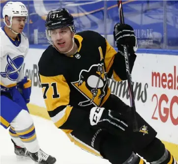  ?? Associated Press ?? Evgeni Malkin celebrates his goal in the first period of Thursday’s 5-2 win over the Sabres in Buffalo, N.Y. He also picked up an assist.