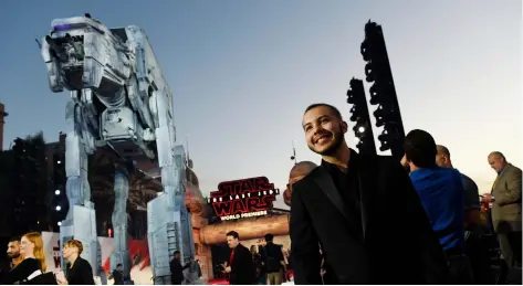  ?? CHRIS PIZZELLO/INVISION/AP ?? Chris Alegria, 18, of Pembroke Pines, Fla., enjoys the view from his spot on the carpet at the premiere of the film Star Wars: The Last Jedi at the Shrine Auditorium in Los Angeles. Alegria was one of seven teens with life-threatenin­g medical...