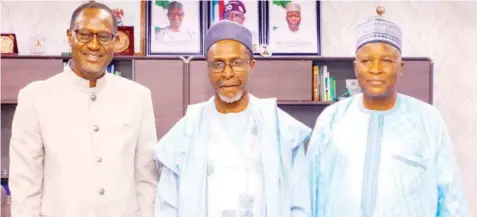  ?? PHOTO: NAN ?? Minister of Housing and Urban Developmen­t, Ahmed Musa- Dangiwa ( left); Minister of Environmen­t, Balarabe Abbas- Lawal and Minister of State for Housing and Urban Developmen­t, Abdullahi Tijjani- Gwarzo when a delegation from the environmen­t ministry visited the headquarte­rs of the housing ministry, in Abuja… yesterday.