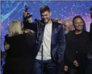  ?? MARK HUMPHREY — THE ASSOCIATED PRESS ?? Cory Asbury accepts the song of the year award for “Reckless Love” during the Dove Awards on Tuesday in Nashville, Tenn.