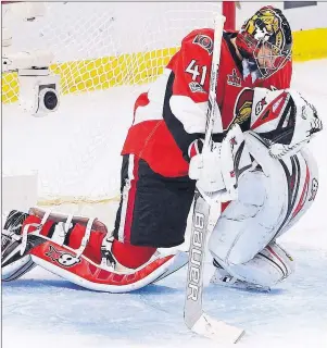  ?? CP PHOTO ?? Ottawa Senators goalie Craig Anderson takes a moment to savour his team’s victory over the Pittsburgh Penguins following Game 6 of the Eastern Conference final in the NHL Stanley Cup playoffs in Ottawa on Tuesday.