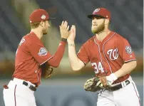  ?? NICK WASS/AP ?? Trea Turner, left, spent his first four seasons in the big leagues playing alongside Bryce Harper with the Nationals.