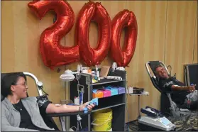  ?? NEWS PHOTO KENDALL KING ?? Regular blood donations have become a tradition for Hatters Randy and Sonia Laughlin, who just passed their 200th combined donation milestone.