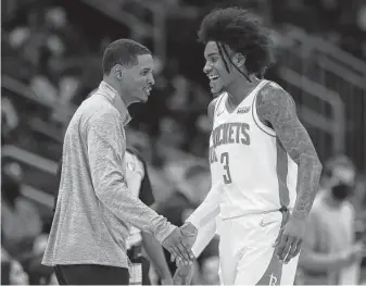  ?? ?? Kevin Porter Jr., with coach Stephen Silas, will join Green in the backcourt. Silas and the team are more concerned about progressin­g and improving this season.