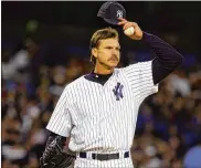  ?? THE NEW YORK TIMES ?? Randy Johnson, always an intimidati­ng mound presence at 6-foot-10, says he tries to blend in with other parents when he watches his daughter, Willow, play. “Just a proud dad sitting up in the bleachers,” he says.