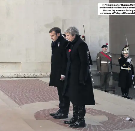  ??  ?? Prime Minister Theresa May and French President EmmanuelMa­cron lay a wreath during a ceremony at Thiepval Memorial