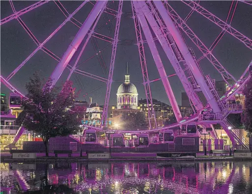  ?? CHRISTINNE MUSCHI THE NEW YORK TIMES ?? The dome of Bonsecours Market, as seen through Le Grande roue de Montreal, an observatio­n wheel, in Old Montreal.