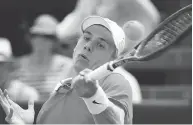  ?? WILLIAM WEST / AFP / GETTY IMAGES ?? Denis Shapovalov of Canada hits a forehand return to Jack Sock of the U.S. during their match on the final day of the Kooyong Classic in Melbourne on Thursday.