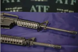  ?? JAE C. HONG — THE ASSOCIATED PRESS FILE ?? Homemade rifles are displayed on a table at an ATF field office in Glendale.