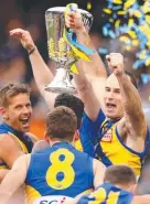  ?? Picture: GETTY ?? Eagles skipper Shannon Hurn hoists the Premiershi­p Cup aloft.