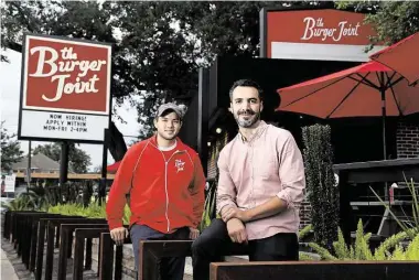  ?? Gary Coronado photos / Houston Chronicle ?? Matthew Pak, left, and Shawn Bermudez appear to have a hit on their hands
with the Burger Joint.