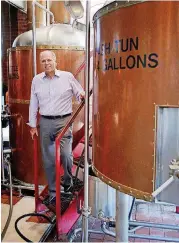  ?? [PHOTO BY DOUG HOKE, THE OKLAHOMAN] ?? Bricktown Brewery CEO Buck Warfield stands in the brewery at the Bricktown location at 1 N Oklahoma Ave.