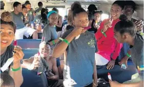  ?? CITY OF HALLANDALE BEACH/COURTESY ?? Forty teens were stranded in a bus along I-95 in Boca when Delray Beach resident Linda Sanders drove by and noticed them sweltering. She came to the rescue with water and Popsicles.