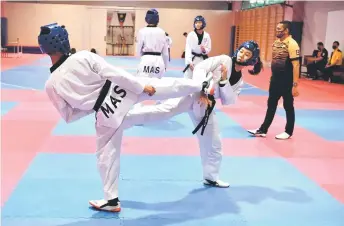  ?? — Bernama photo ?? Taekwondo exponents train at the National Sports Council in Kuala Lumpur.