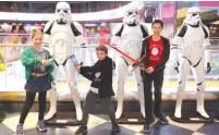  ?? (Marc Israel Sellem/The Jerusalem Post) ?? YOUNG ‘STAR WARS’ fans get ready for the Israeli premiere of ‘Star Wars: The Rise of Skywalker’ last night at Cinema City in Jerusalem.