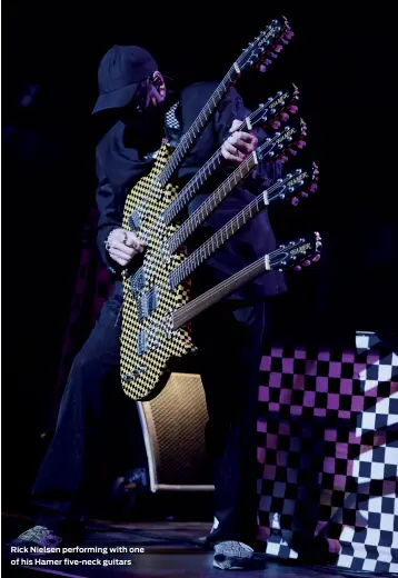  ??  ?? Rick Nielsen performing with one of his Hamer five-neck guitars