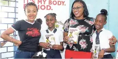  ??  ?? Author and activist Shelly-Ann Weeks gifted books to some students and the guidance counsellor at St Alban’s Primary as a part of the Free HerFlow School Tour.