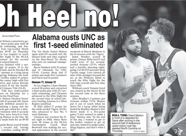  ?? Getty Images ?? ROLL TIDE: Grant Nelson in front of a dejected RJ Davis after scoring in the second half of Alabama’s upset victory over topseeded North Carolina on Thursday.