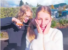  ?? Photo / Rebecca Mauger ?? Kyla Walker gets ready for the ponytail chop of her long mane just before Waihi College's Shave for a Cure event.