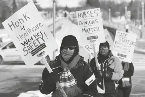  ?? ASSOCIATED PRESS ?? NURSES PICKET FRIDAY IN FARIBAULT, MINN., during a healthcare worker protest of a shortage on protective masks.