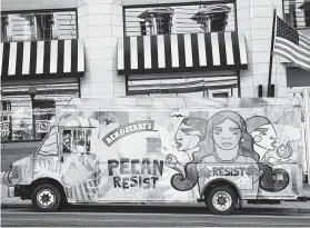  ?? Joy Asico / Associated Press / For Ben & Jerry’s ?? A truck Tuesday spreads the word about Pecan Resist — chocolate ice cream with white and dark fudge chunks, pecans, walnuts and fudge-covered almonds.